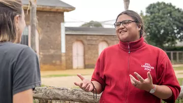 Volunteer speaking to visitor at London Zoo