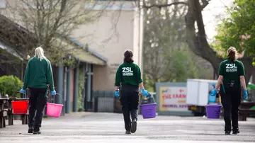 three_zookeepers_social_distanced_at_London_zoo_holding buckets