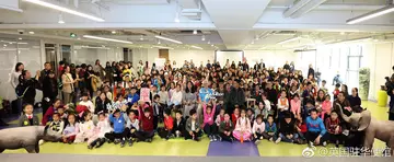 Group photo in conference hall of lots of children and and adults at pangolin conference talk