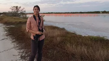 Heida Ma with camera and binoculars 