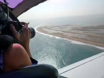 aerial photographer taking photos of Thames Estuary 