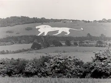 Chalk white lion on hillside by Whipsnade Zoo