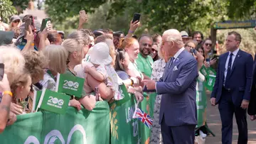 HRM King Charles meets staff and members of the public outside penguin beach