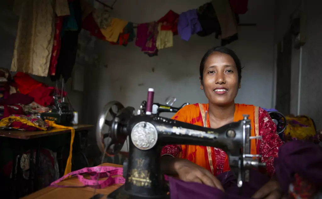 Gayatri Rai smiling whilst sewing