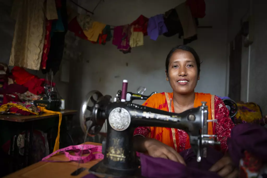 Gayatri Rai smiling whilst sewing