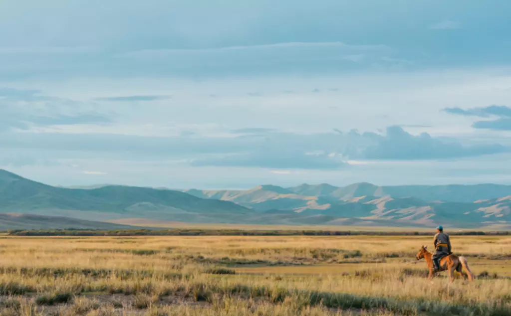 Horse back rider in the Mongolia steppes