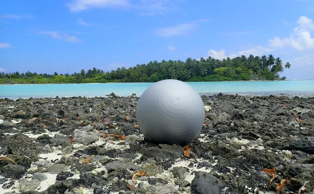 Plastic sports ball washed up on tropical shore