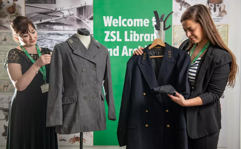 ZSL archivist Natasha Wakely and Bicentenary Project Manager Tina Campanella inspect historic zoo uniforms