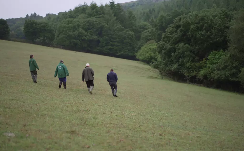 NFU and ZSL team walking together to site for badger vaccinations