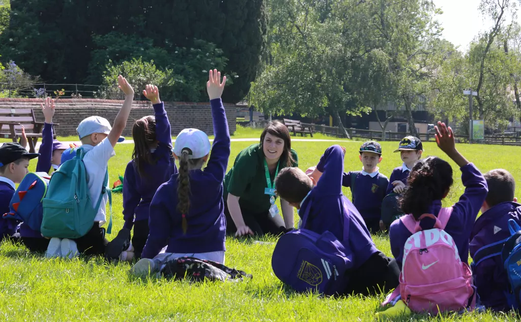 A ZSL education team member teaches students outside