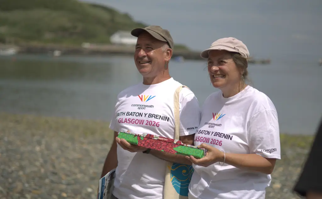 Volunteers Terri and Bob with Welsh Baton for Kings Baton Relay