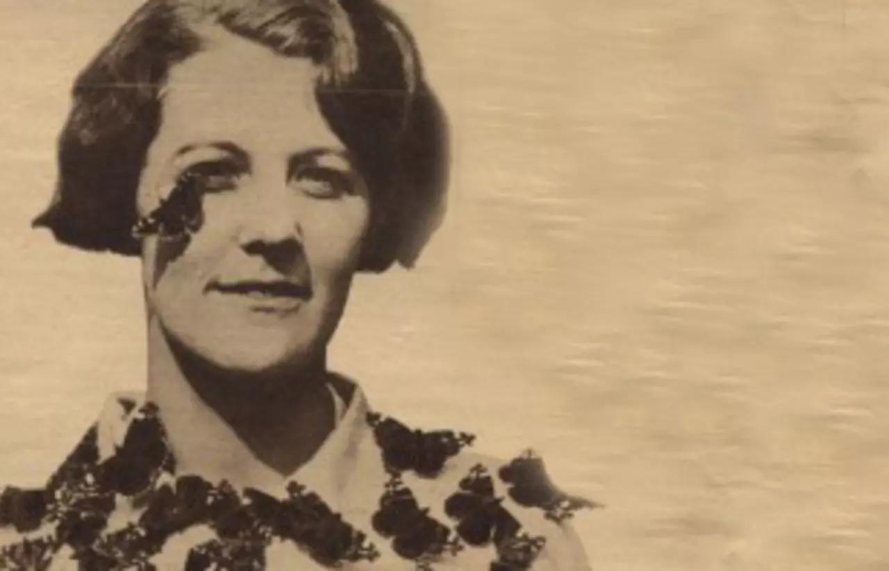Evelyn Cheesman with butterflies covering her