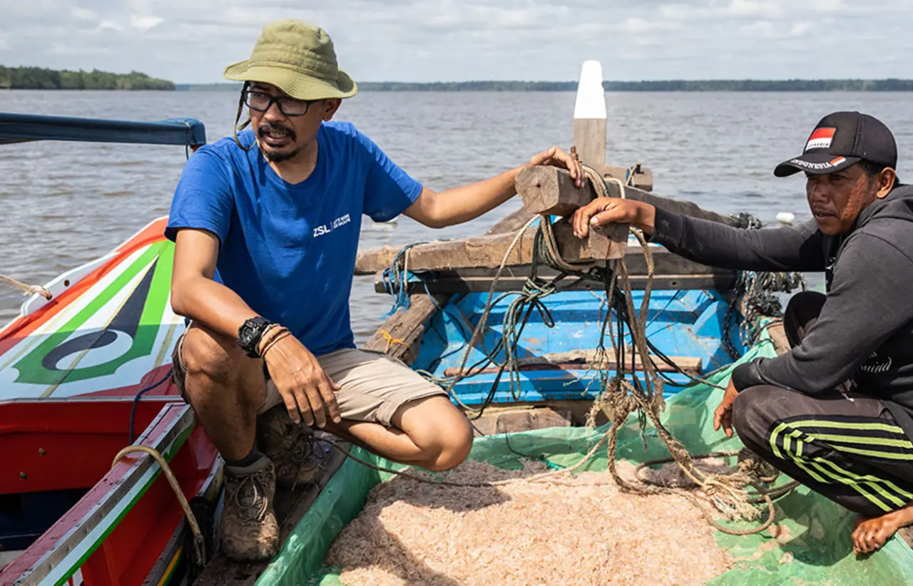 conservationists in Indonesia in boat