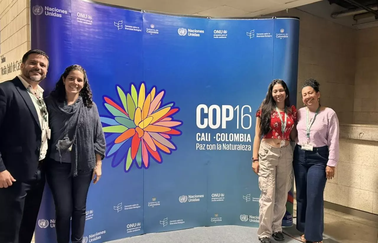 Davi Teles, Mónica Franco Gutiérrez, Andrea Natalia Martínez Bulla and Liliana Patricia Saboyá Acosta stood in front of a COP16 sign 