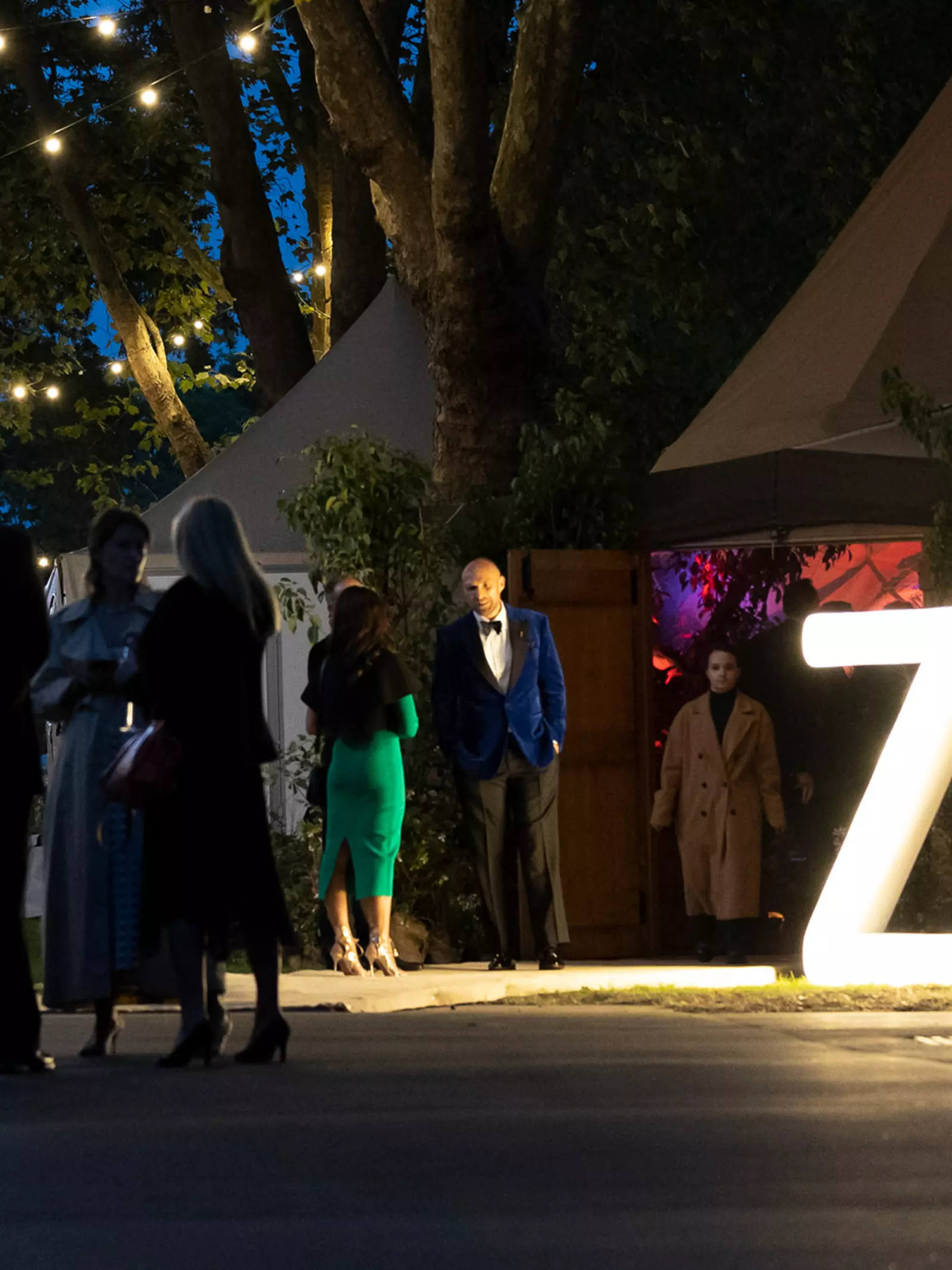Guests gather outside at the gala at London Zoo