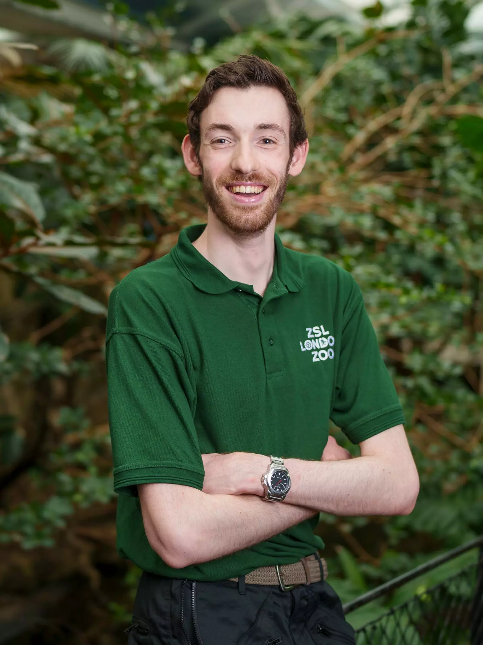 London zoo volunteer in green shirt