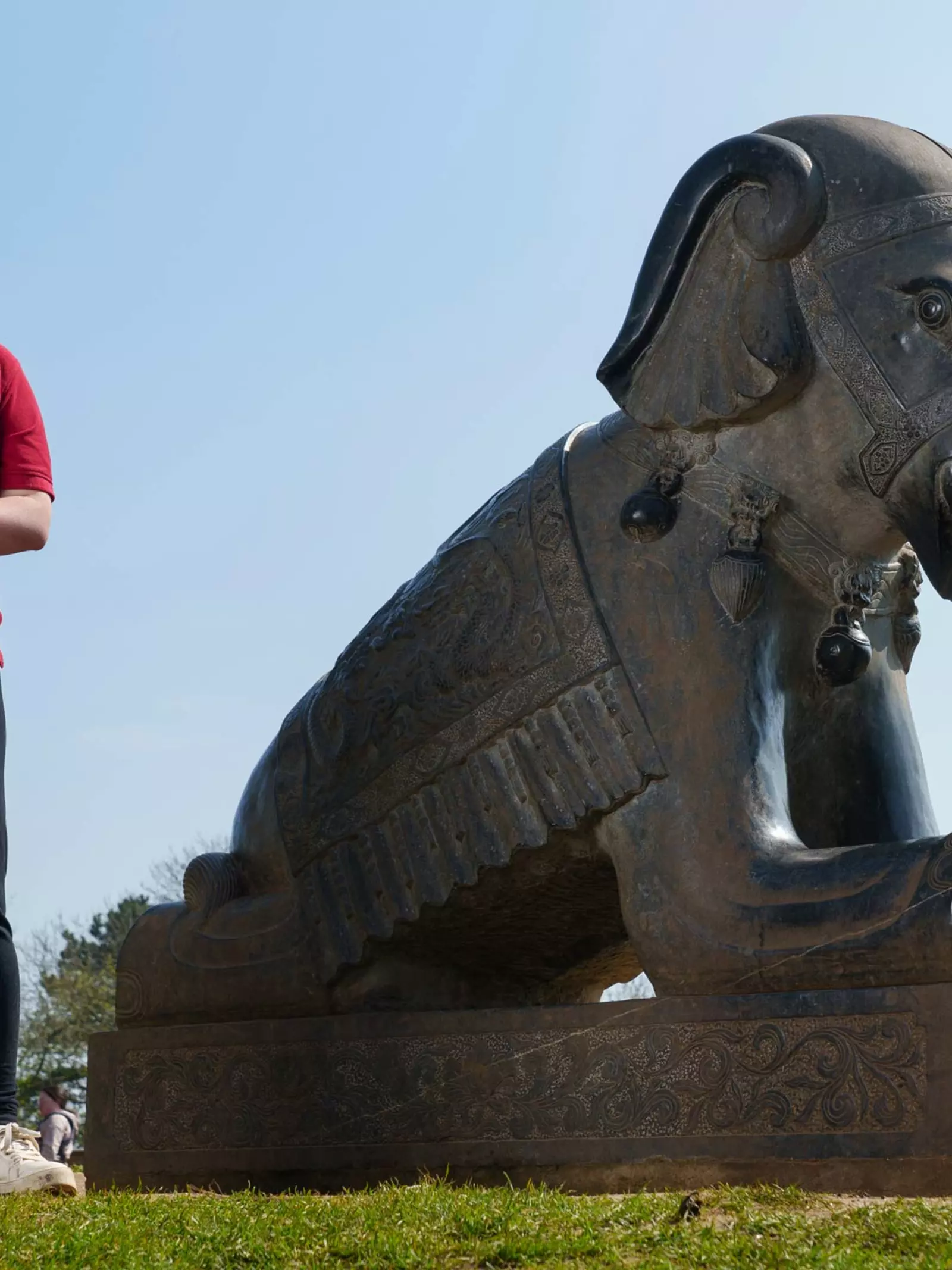 Kim Lloyd Whipsnade Zoo volunteer by elephant statue
