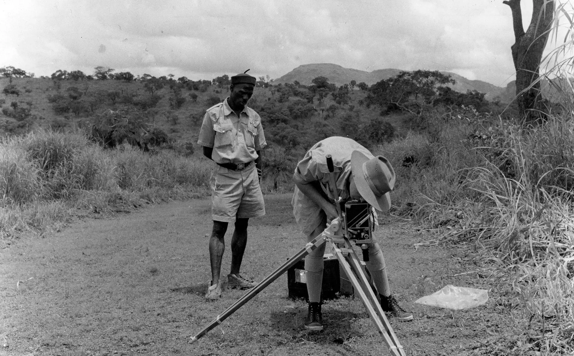 A black and white photograph of Charles Lagus filming Zoo Quest