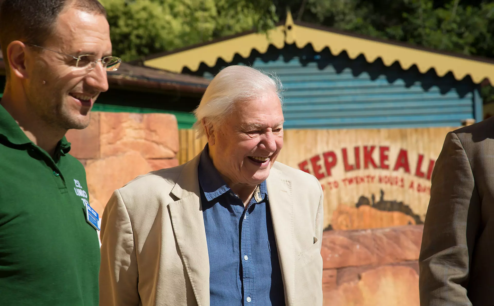 Sir David Attenborough and a zookeeper standing by Land of the Lions at London Zoo