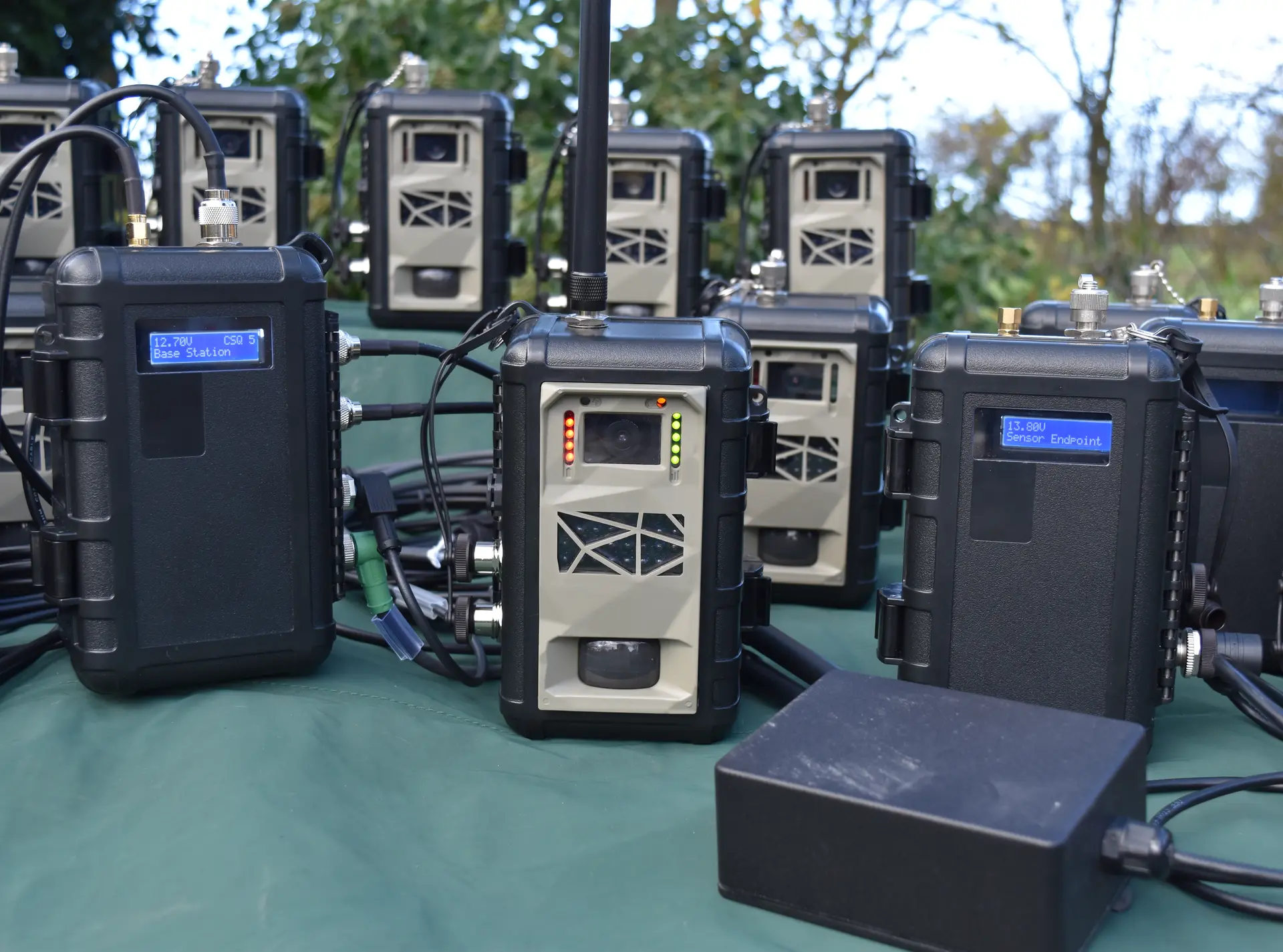 An Instant Detect 2.0 Base Station, Camera and Sensor Endpoint with a metal triggered sensor.