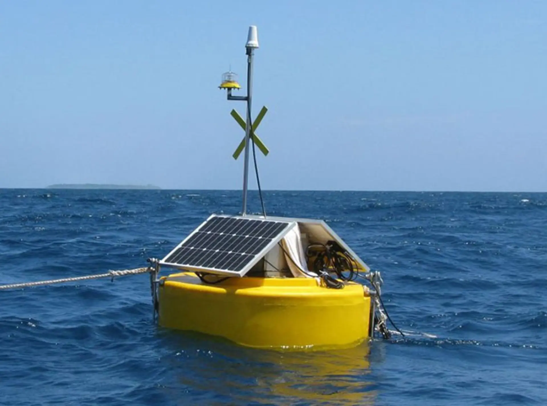 A bouy in the ocean with sensors being used to detect illegal fishing vessels