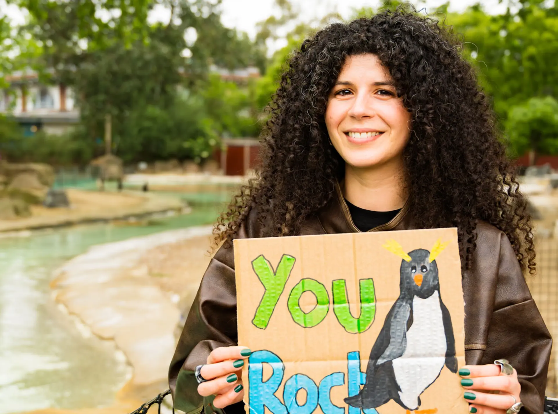 Sandra holding thank you sign