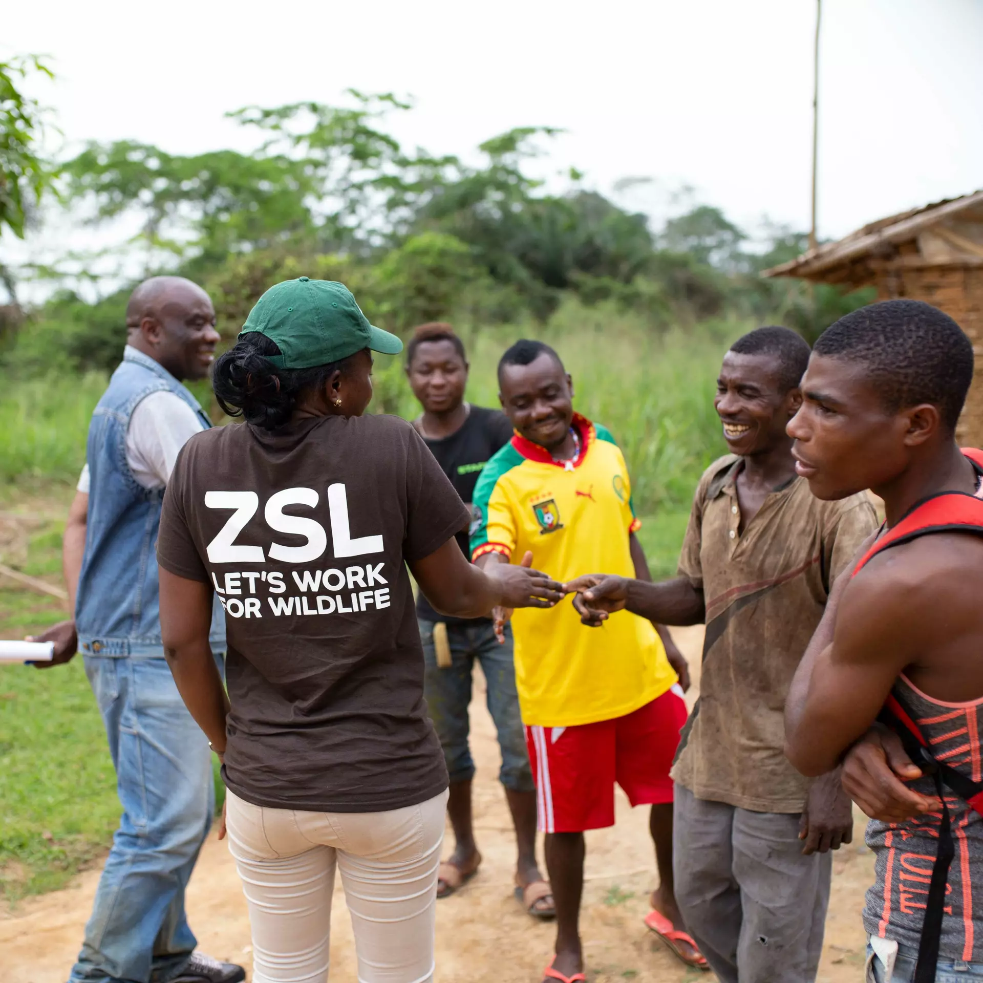 ZSL conservationist chatting with locals in Dja faunal reserve 