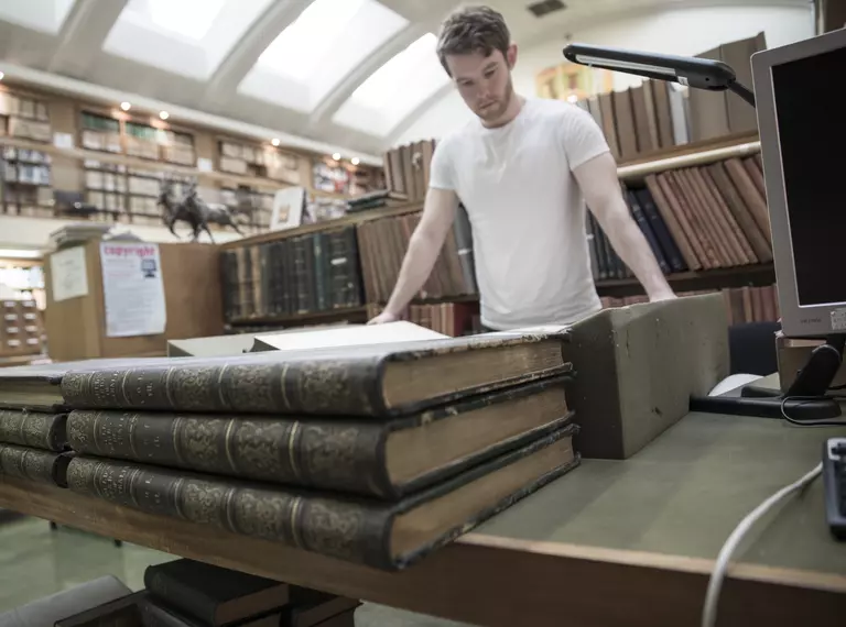 David Lowther ZSL Library's 2014 Visiting Scholar looking through works of John Gould