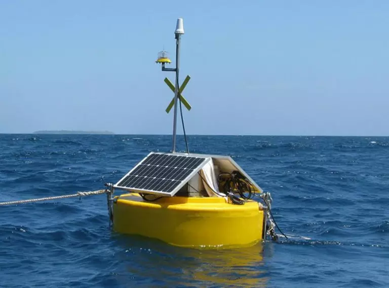 A bouy in the ocean with sensors being used to detect illegal fishing vessels