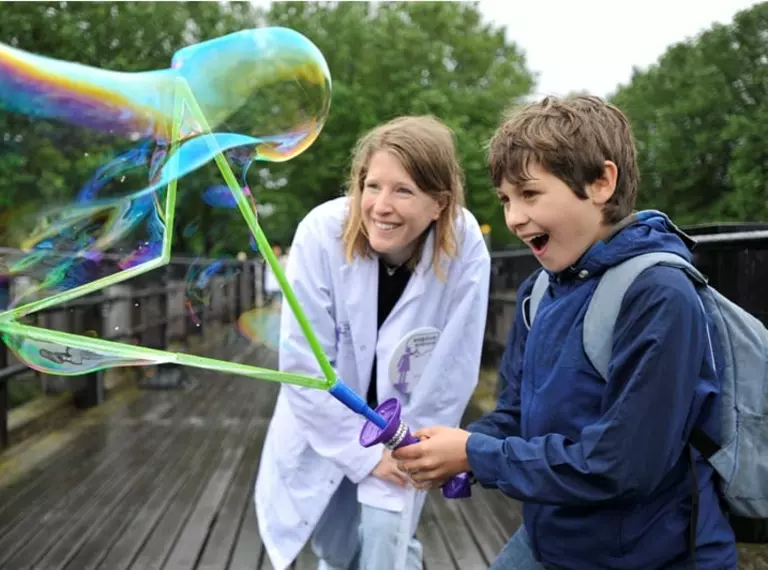 soapbox scientist with child and big bubble