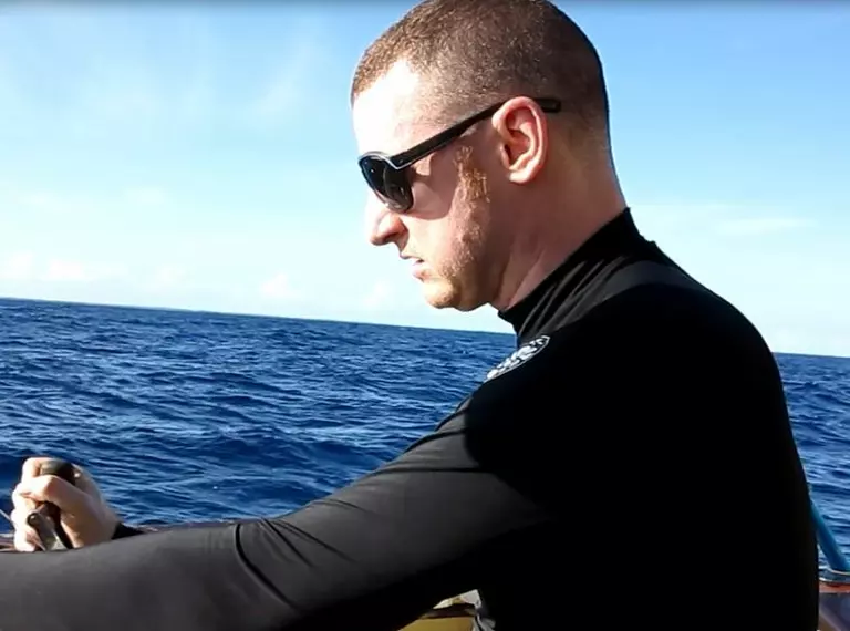 Matt Gollock on a boat