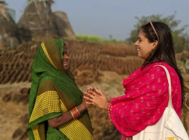 Conservationist Surshti Patel speaking with woman as part of work in community-led conservation