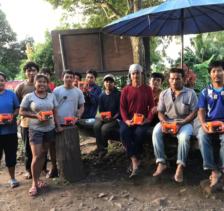 Group in Thailand with flashlights 