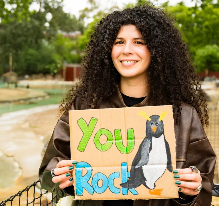 Sandra holding thank you sign