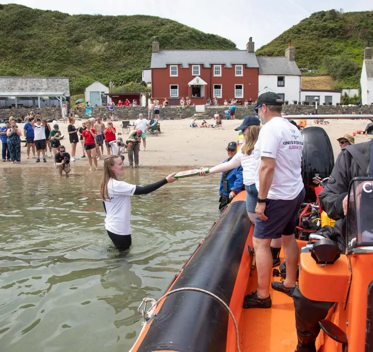 Baton being handed between participants in Kings Baton Relay in Wales.JPG